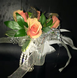 Coral Rose Wrist Corsage from Faught's Flowers & Gifts, florist in Jonesboro