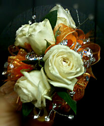 Orange Ya Gonna Kiss Me Corsage from Faught's Flowers & Gifts, florist in Jonesboro